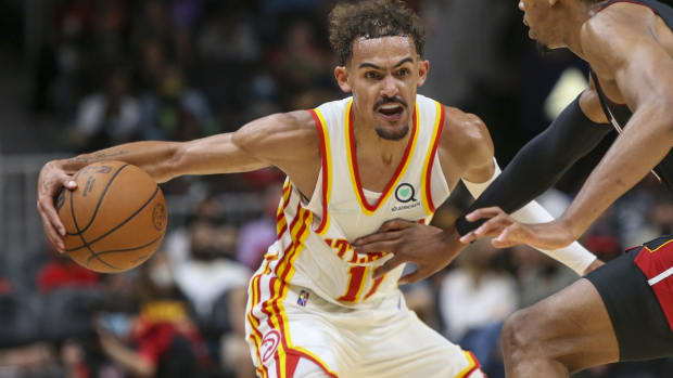 Oct 14, 2021; Atlanta, Georgia, USA; Atlanta Hawks guard Trae Young (11) is defended by Miami Heat forward KZ Okpala (11) in the second half at State Farm Arena. Mandatory Credit: Brett Davis-USA TODAY Sports